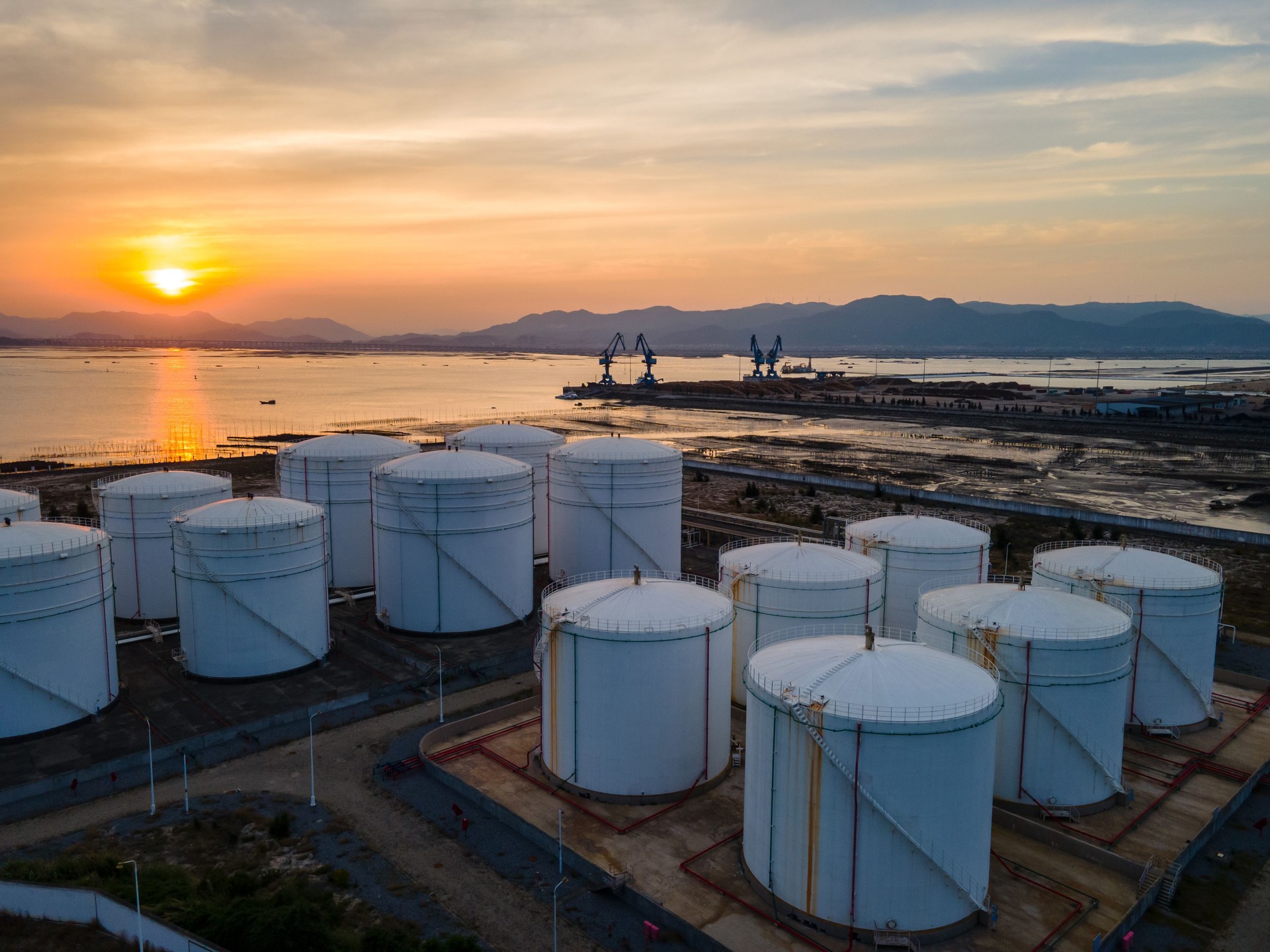 Aerial view of coastal port and oil storage